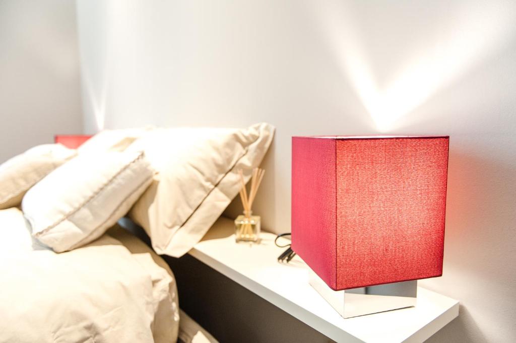 A bed or beds in a room at Italianflat - Arena di Verona Apartments