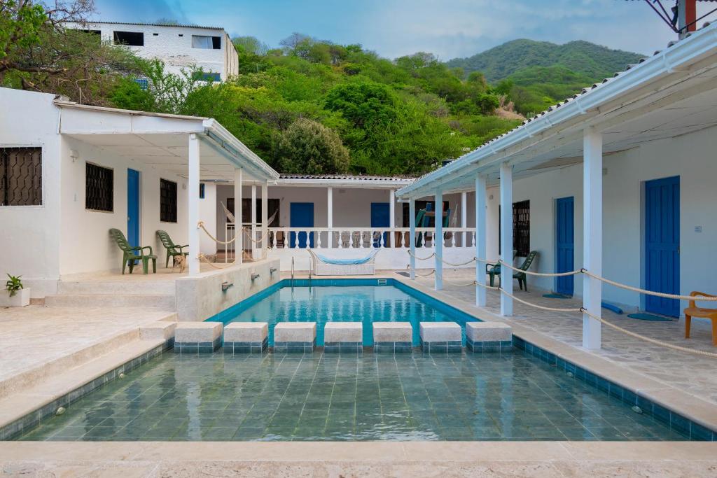 a swimming pool in the backyard of a house at Casa Toboro in Taganga