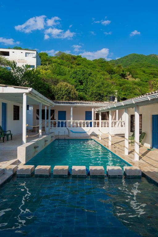 a swimming pool with a view of a building at Casa Toboro in Taganga