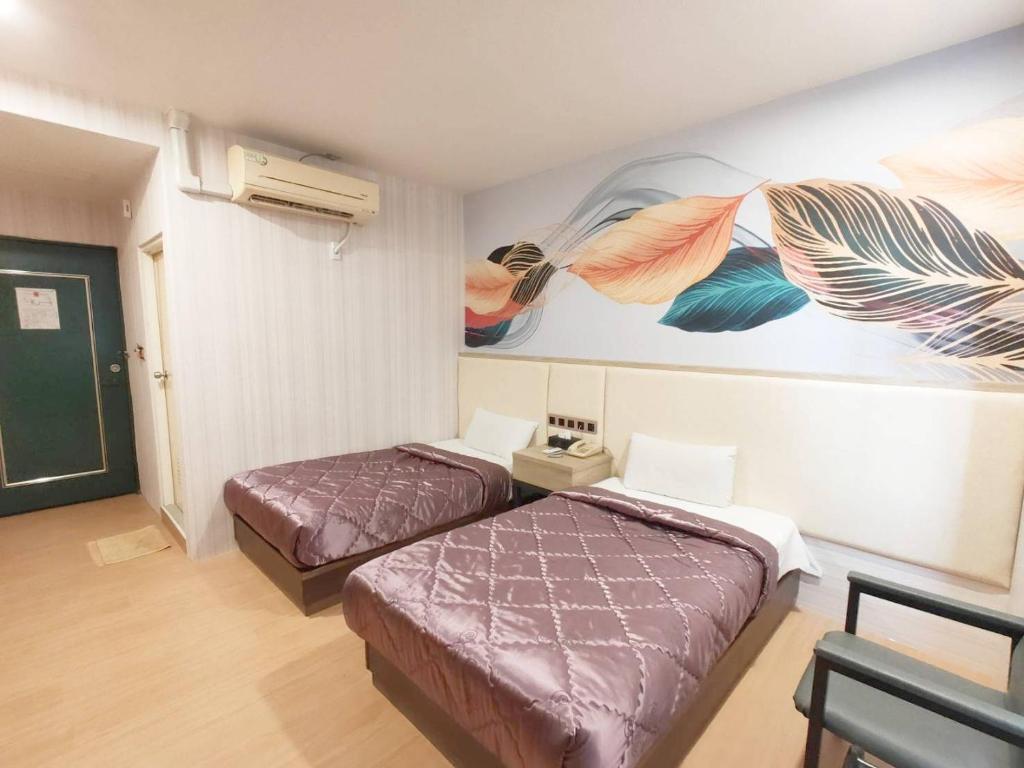 Postel nebo postele na pokoji v ubytování Royal Business Hotel