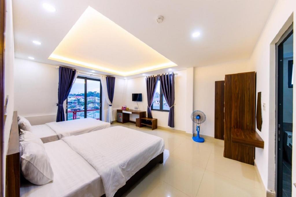 Giường trong phòng chung tại Đà Lạt Cao Nguyên Hotel