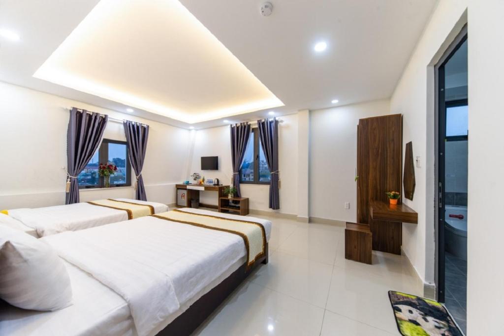 Giường trong phòng chung tại Đà Lạt Cao Nguyên Hotel