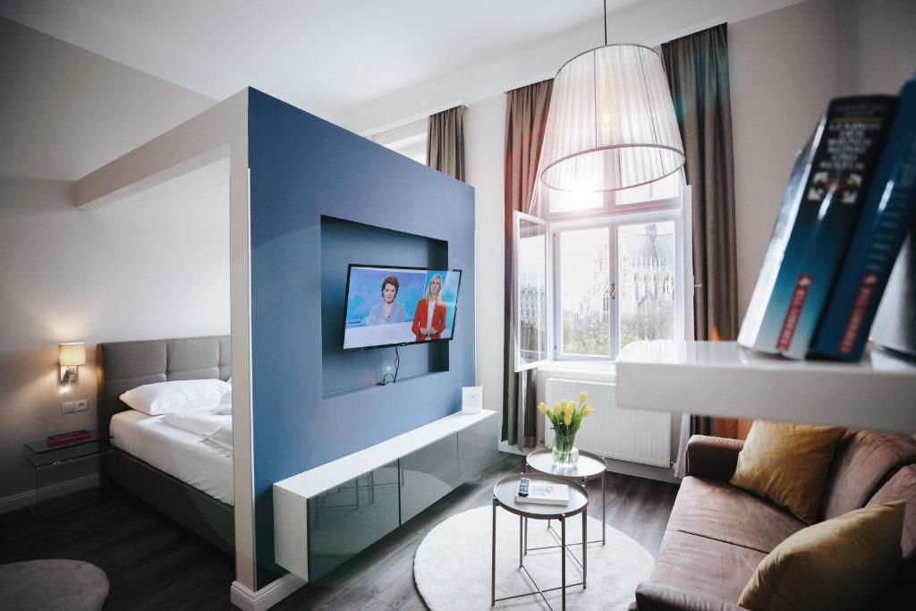 Posteľ alebo postele v izbe v ubytovaní KH Apartments Universitaet