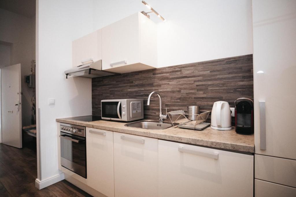 Kuchyňa alebo kuchynka v ubytovaní KH Apartments Universitaet