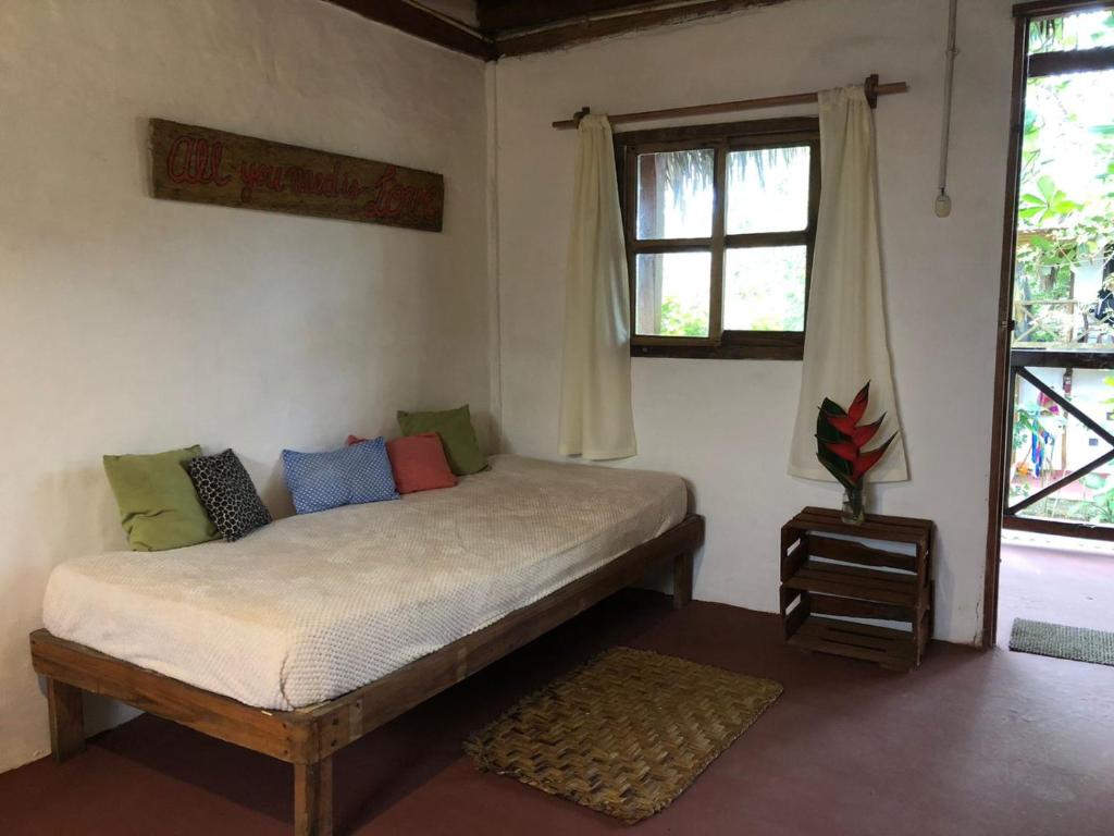 Postel nebo postele na pokoji v ubytování Hostal Los Orishas
