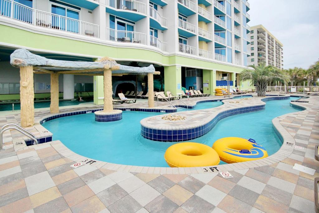 a swimming pool at a hotel with a resort at Club Wyndham 521 in Myrtle Beach