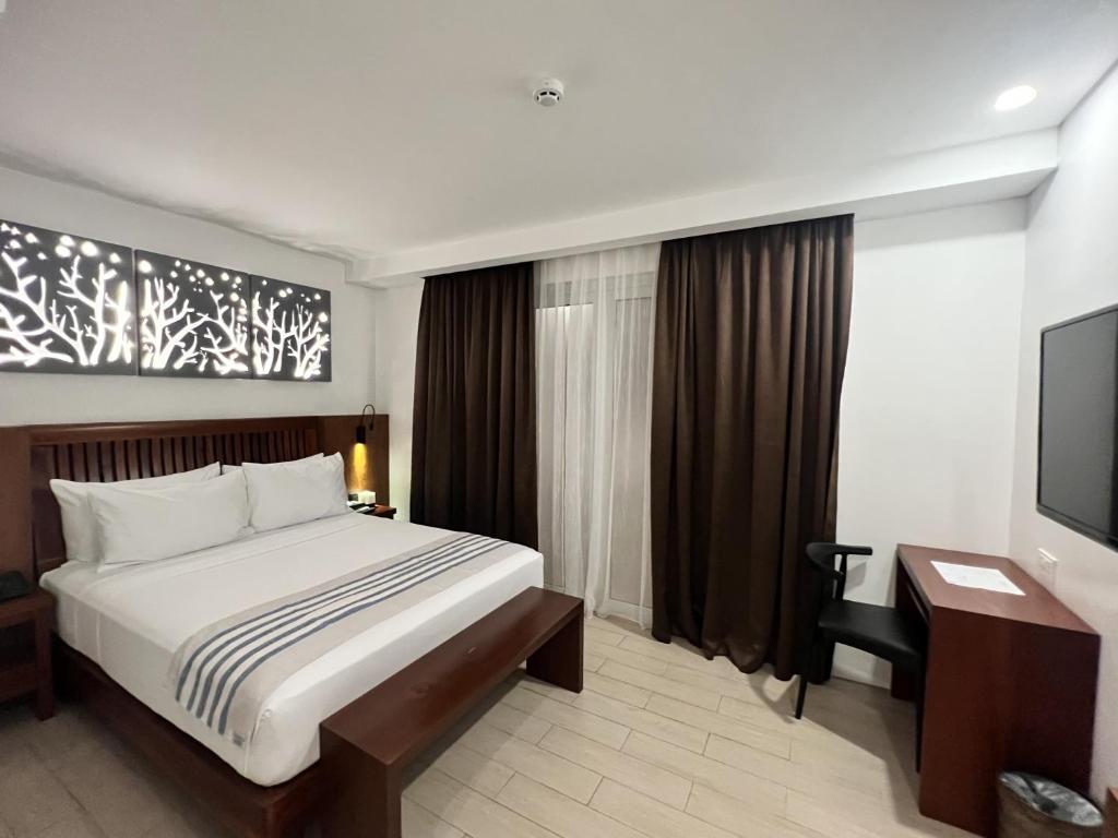 Postel nebo postele na pokoji v ubytování Aira Boracay Hotel