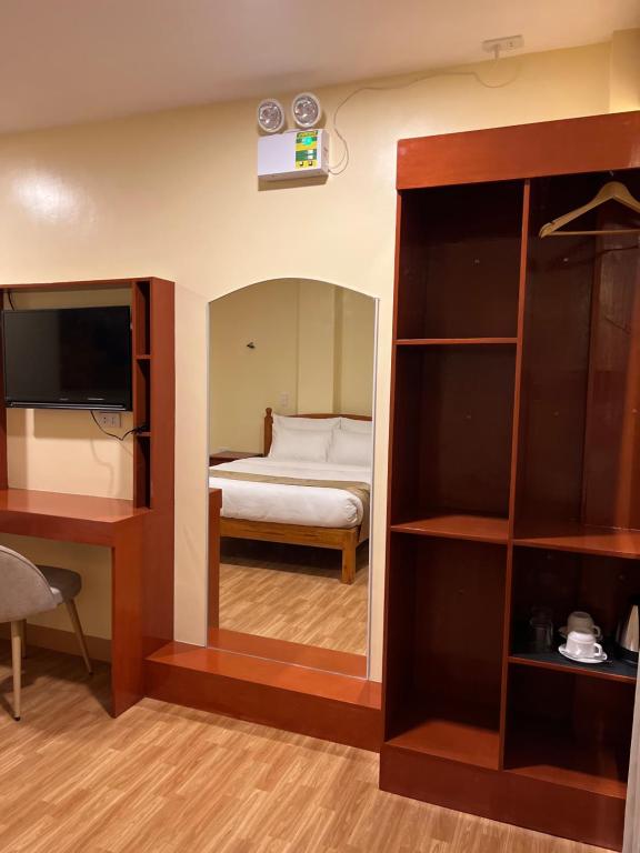 Postel nebo postele na pokoji v ubytování Rufana Suites