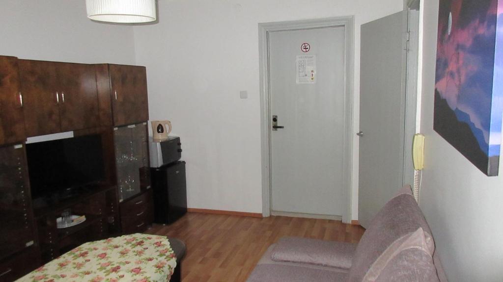TV a/nebo společenská místnost v ubytování Nepi Hotell