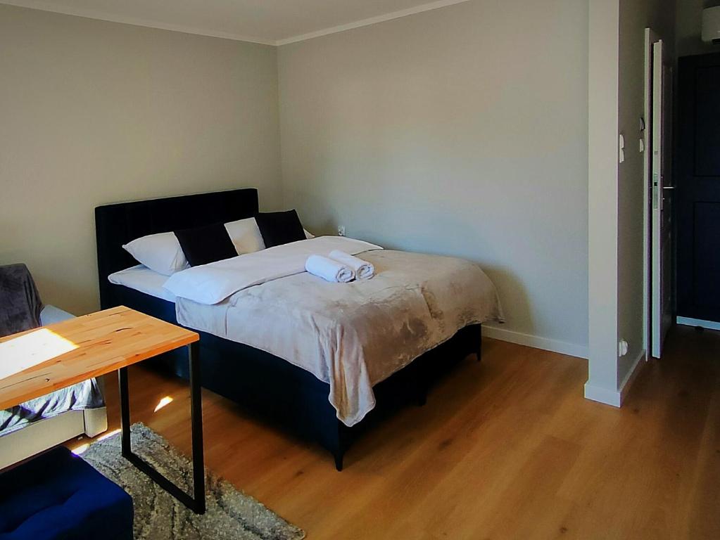 Postel nebo postele na pokoji v ubytování Hugo Eden Apartments