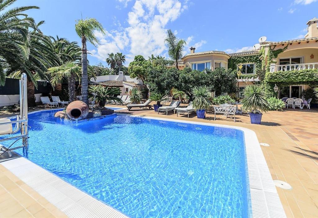 a large swimming pool in front of a house at Xenofilia 3 in Moraira