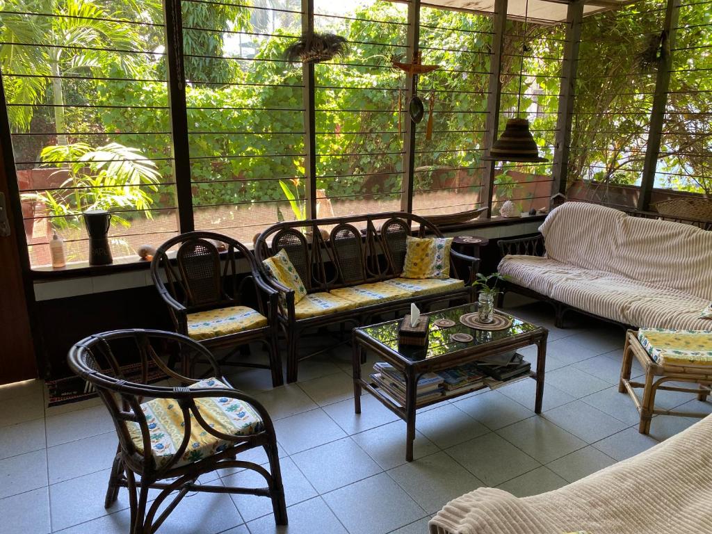 a living room with chairs and a couch and a table at Homestay Galpera Papua in Jayapura