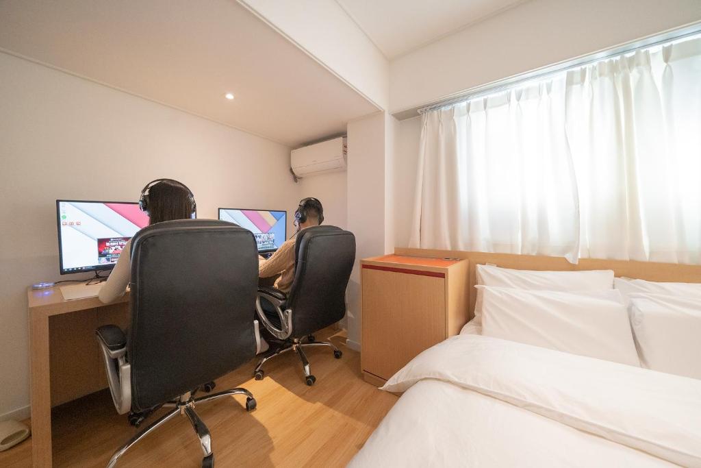 TV a/nebo společenská místnost v ubytování Aank Hotel Guri