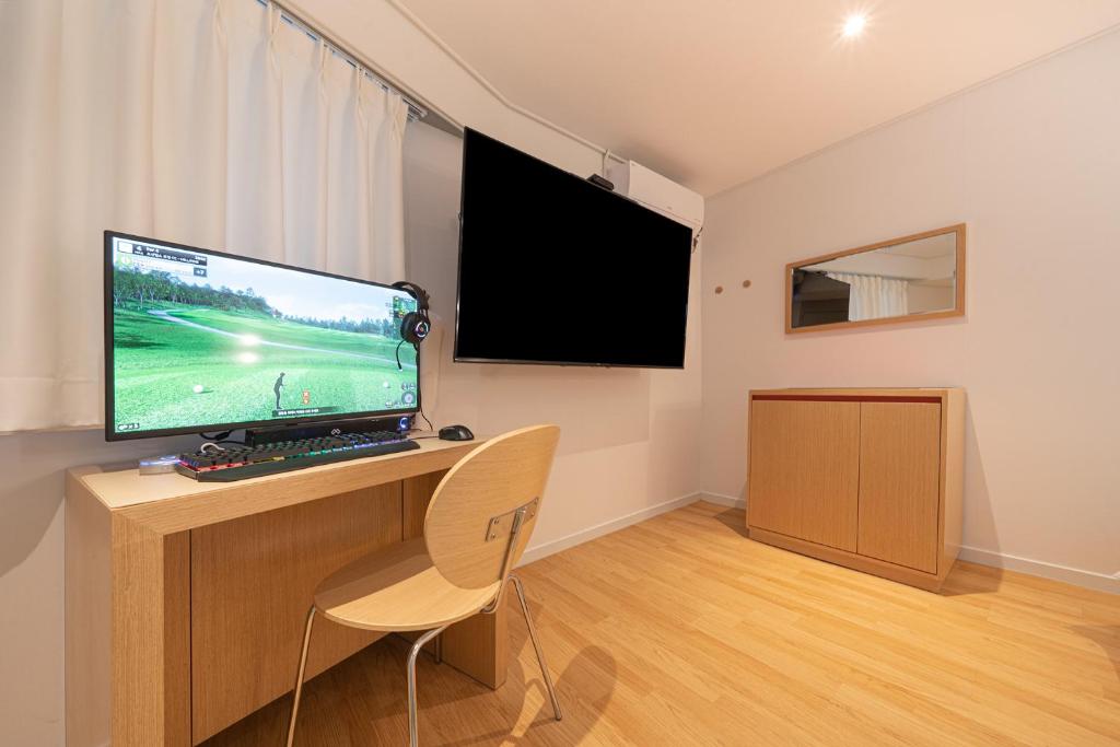 TV a/nebo společenská místnost v ubytování Aank Hotel Guri