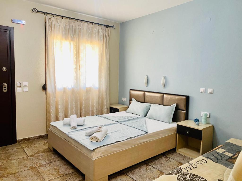 Postel nebo postele na pokoji v ubytování JASMINE STUDIOS POTOS