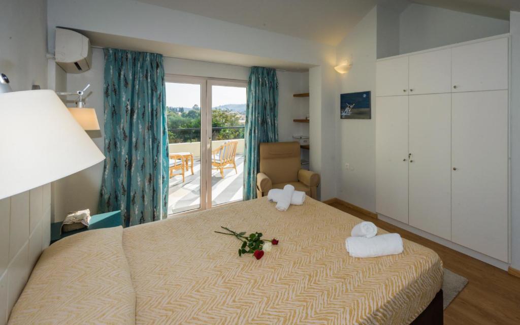 Postel nebo postele na pokoji v ubytování Helion Apartments