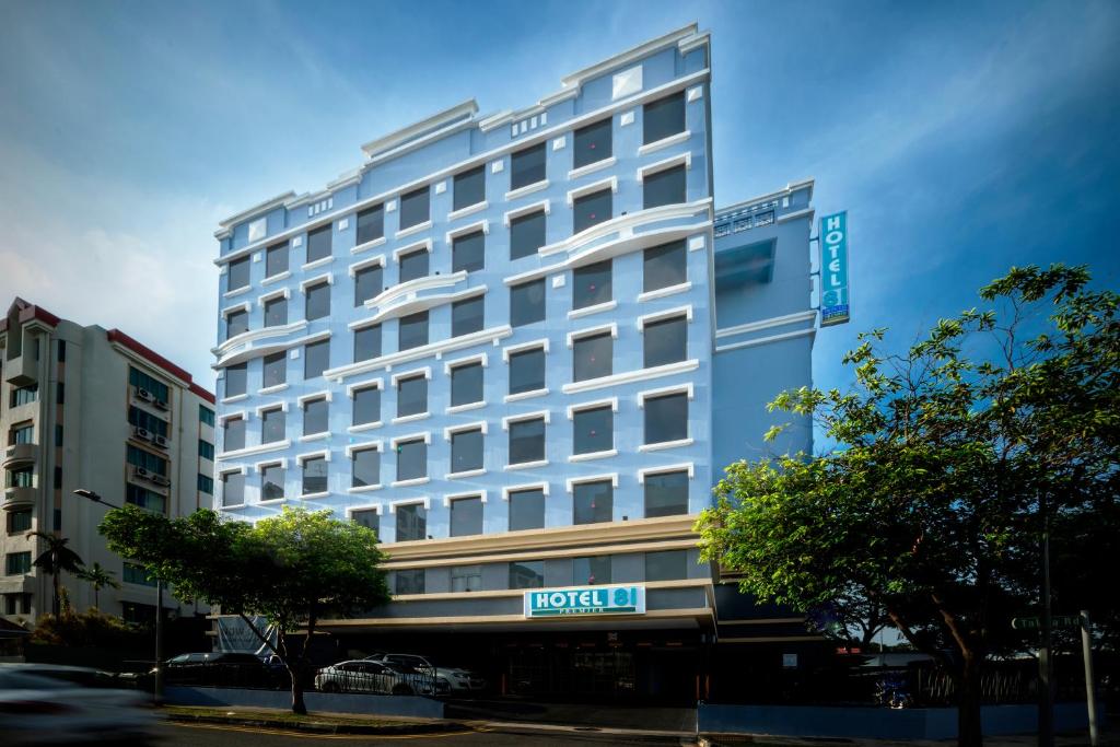 a hotel building with a sign on the front of it at Hotel 81 Premier Princess in Singapore