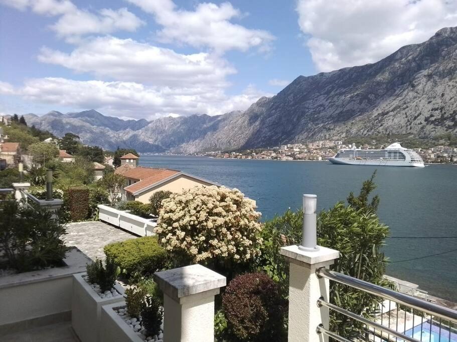 a cruise ship in a large body of water at Two bedroom Apartment in Kotor Bay in Muo