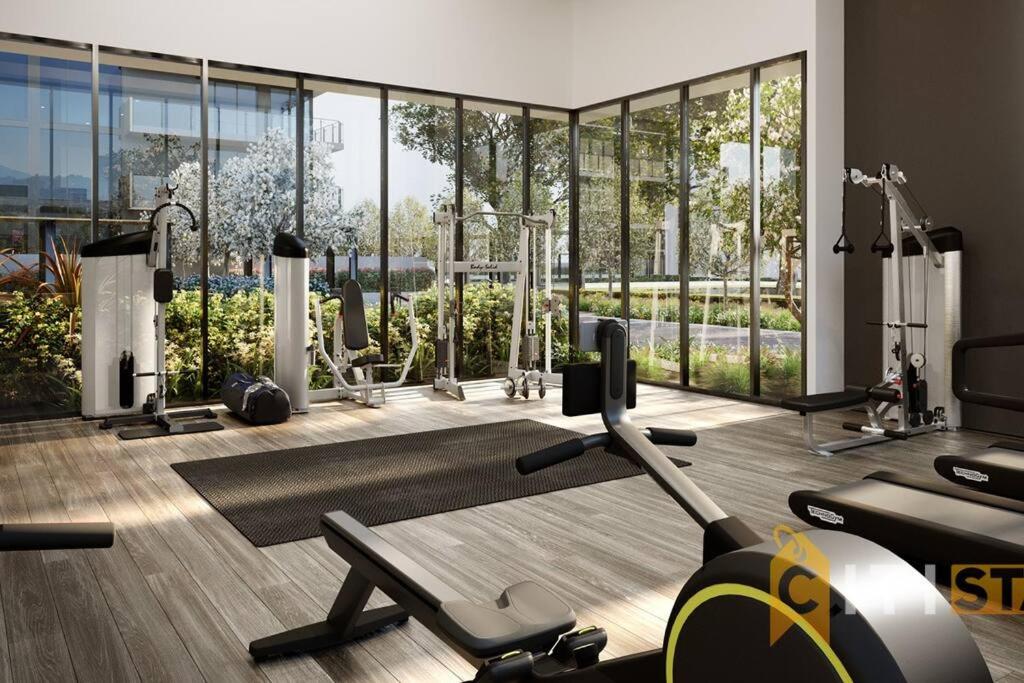 a gym with exercise equipment and a large window at Fab in Phillip - 2bd 2bth Apt - Close to CBR Hospital in Phillip