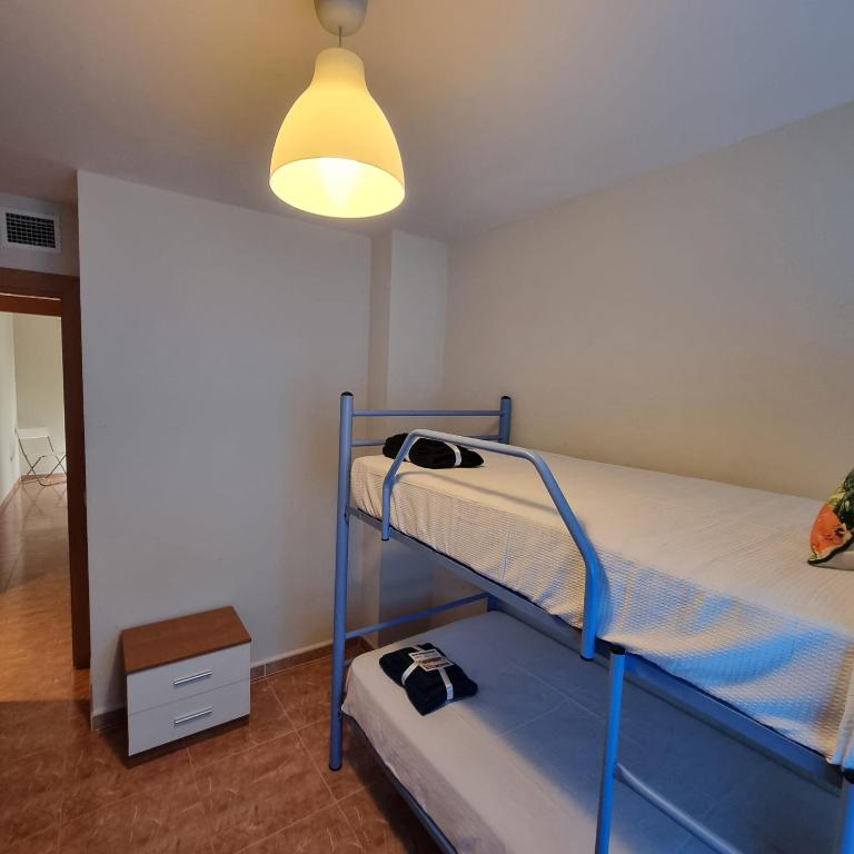 A bed or beds in a room at Ático dúplex con piscina privada en Vera Playa