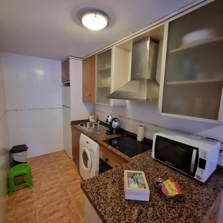 A kitchen or kitchenette at Ático dúplex con piscina privada en Vera Playa