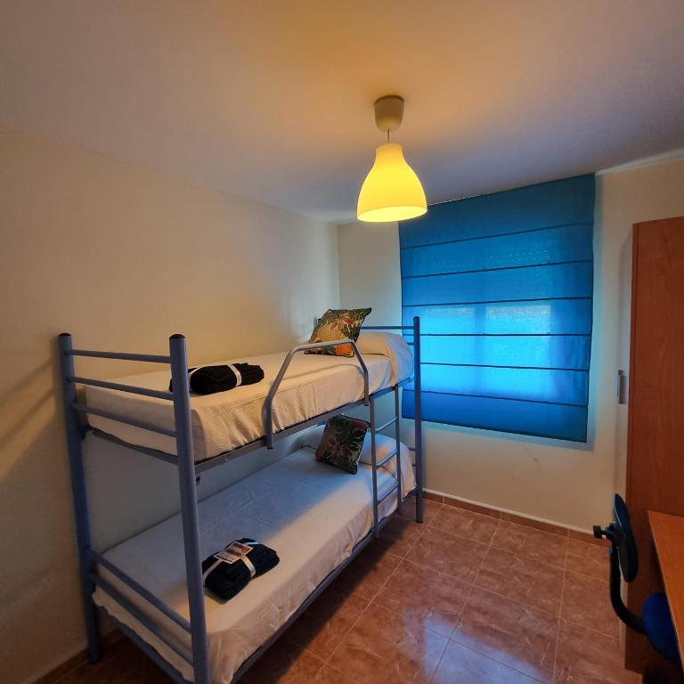 A bed or beds in a room at Ático dúplex con piscina privada en Vera Playa