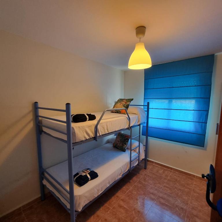 A bed or beds in a room at Ático dúplex con piscina privada en Vera Playa