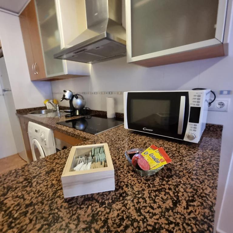 A kitchen or kitchenette at Ático dúplex con piscina privada en Vera Playa