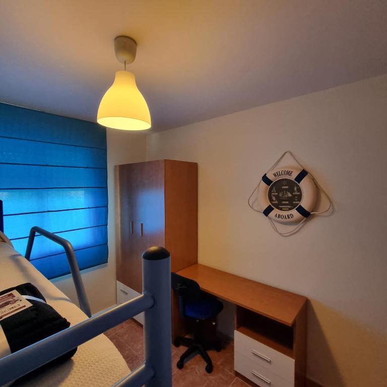A bed or beds in a room at Ático dúplex con piscina privada en Vera Playa