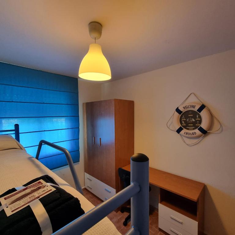 A bed or beds in a room at Ático dúplex con piscina privada en Vera Playa