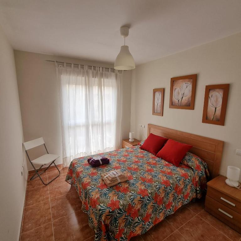 A bed or beds in a room at Ático dúplex con piscina privada en Vera Playa