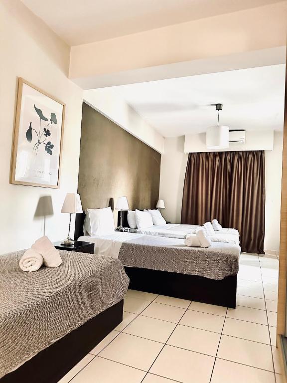 Postel nebo postele na pokoji v ubytování Mc Queen Rooms & Apartments