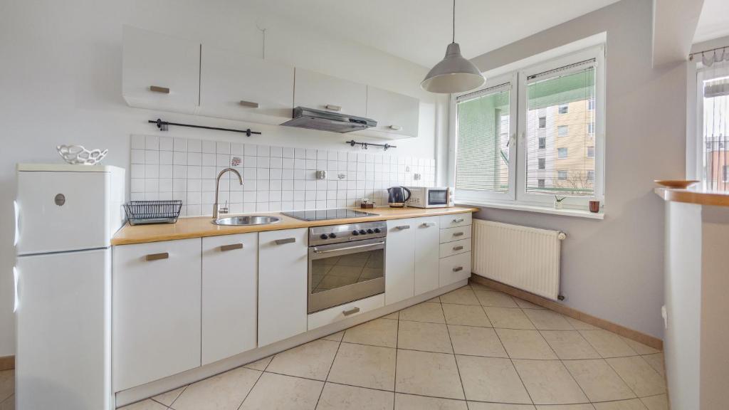 Kuchyňa alebo kuchynka v ubytovaní Apartamenty Sun & Snow Legionów