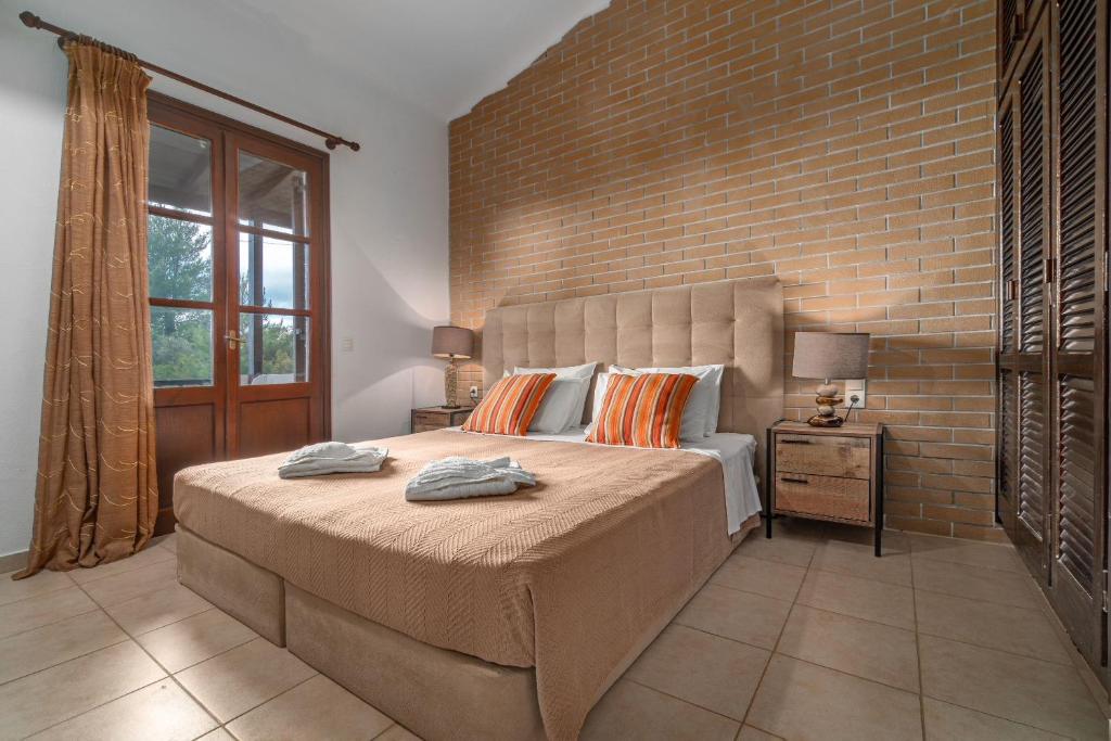 Postel nebo postele na pokoji v ubytování Margi House