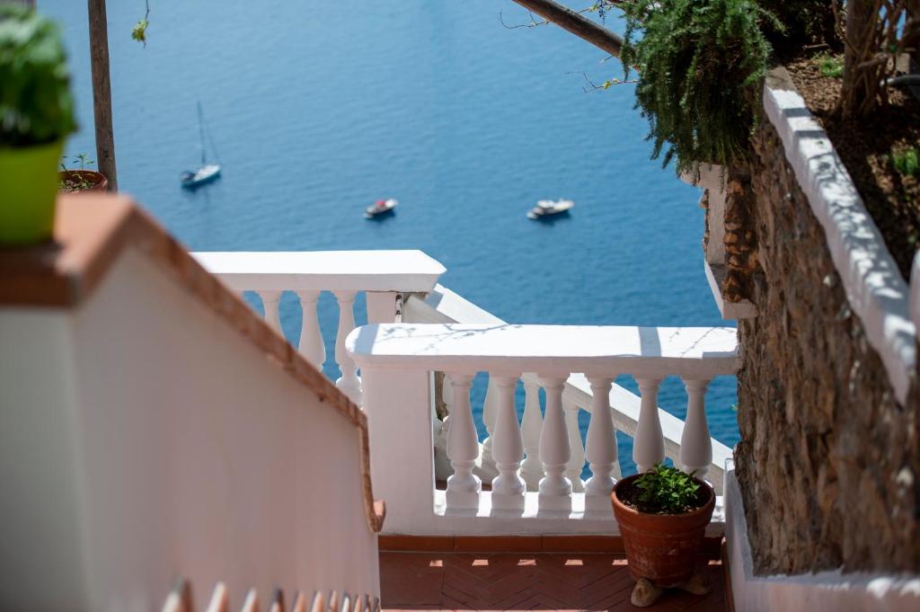 a white staircase with a view of the water at Villa Briganti Seaview Terrace in Positano