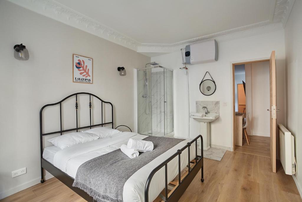 Posteľ alebo postele v izbe v ubytovaní Apartment Parc des expositions by Studio prestige