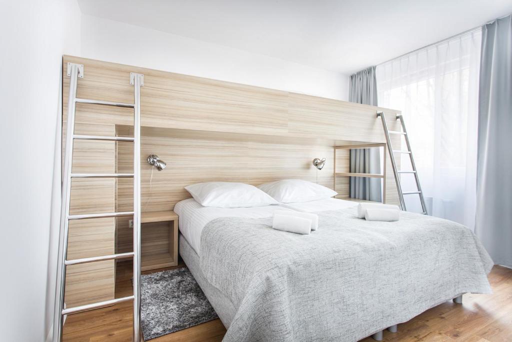 Posteľ alebo postele v izbe v ubytovaní Smart Hotel