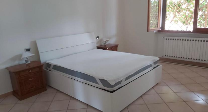 מיטה או מיטות בחדר ב-Cà Delmo