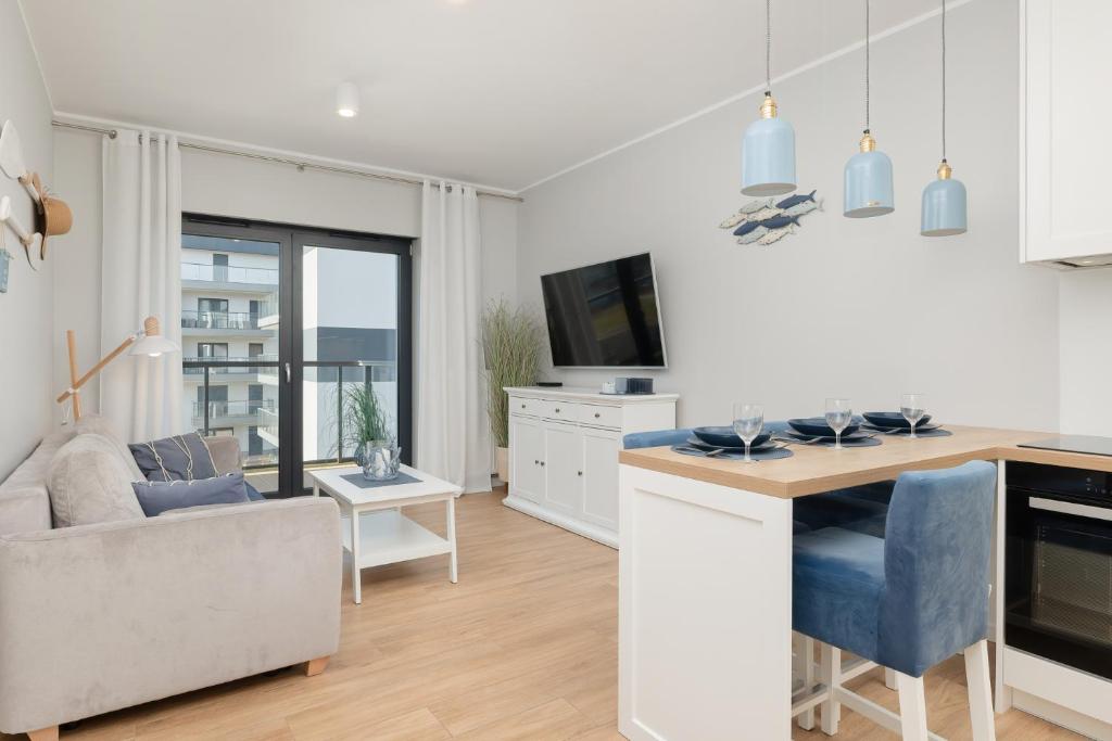 Kuchyňa alebo kuchynka v ubytovaní Apartamenty Morska Fala-Gardenia