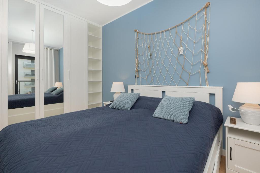 Posteľ alebo postele v izbe v ubytovaní Apartamenty Morska Fala-Gardenia