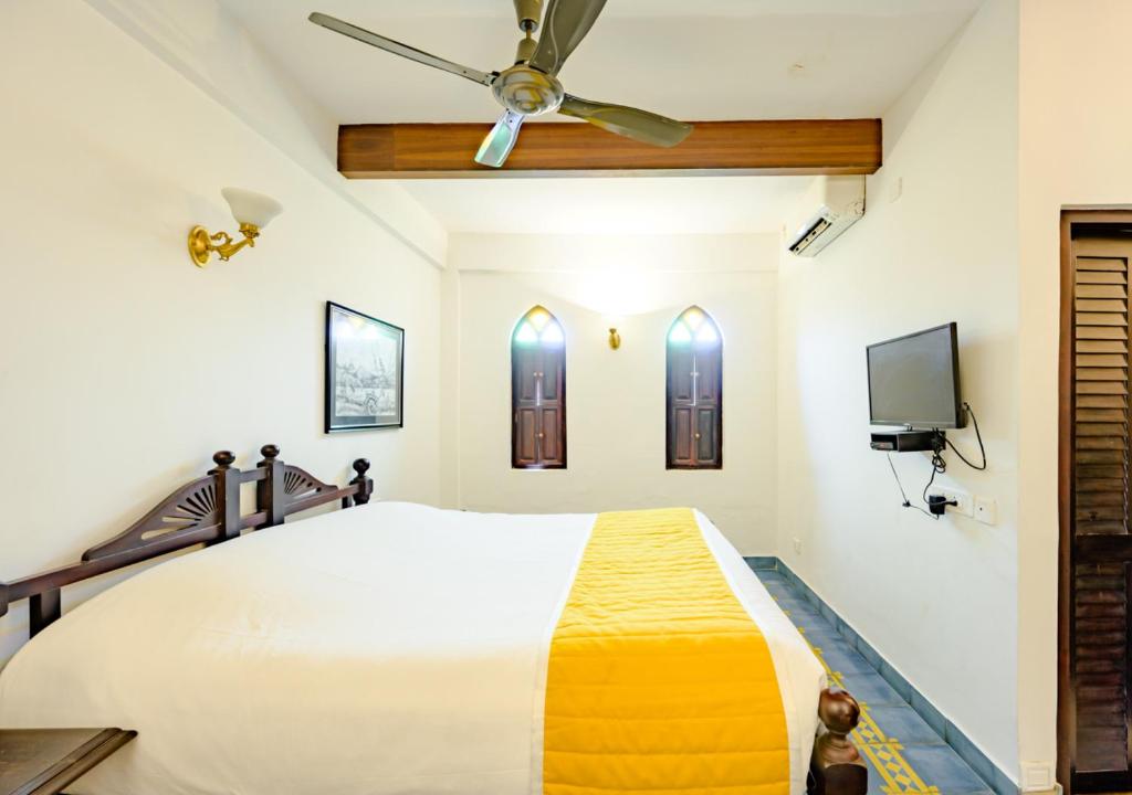 Llit o llits en una habitació de Bloom Boutique Waterfront Fort Kochi