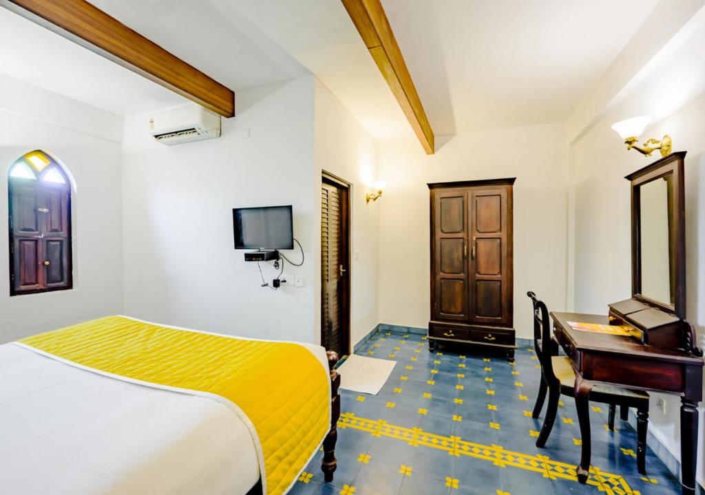 Llit o llits en una habitació de Bloom Boutique Waterfront Fort Kochi