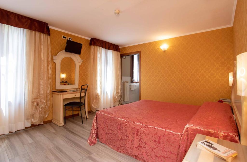 Voodi või voodid majutusasutuse Hotel Tintoretto toas