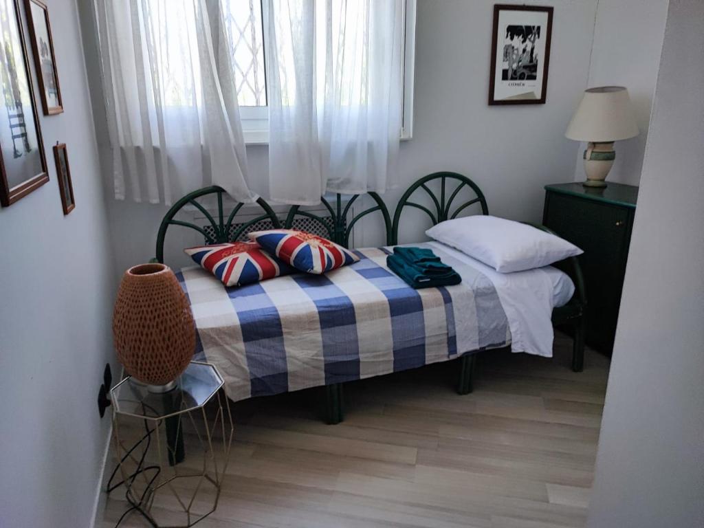 Postel nebo postele na pokoji v ubytování Villa Adriana relax