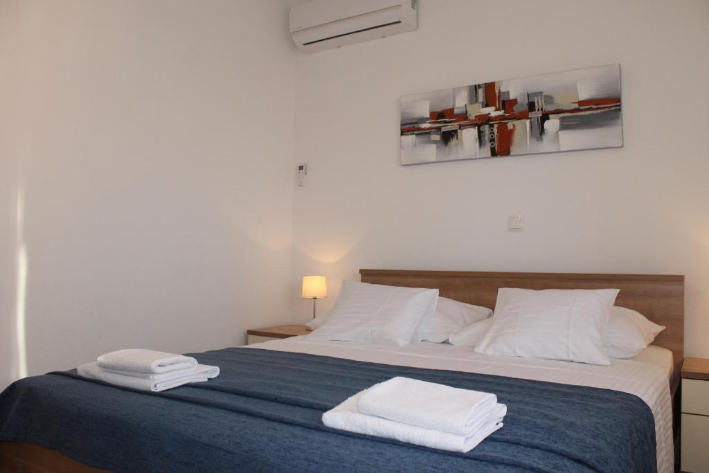 Posteľ alebo postele v izbe v ubytovaní Apartments Valeria