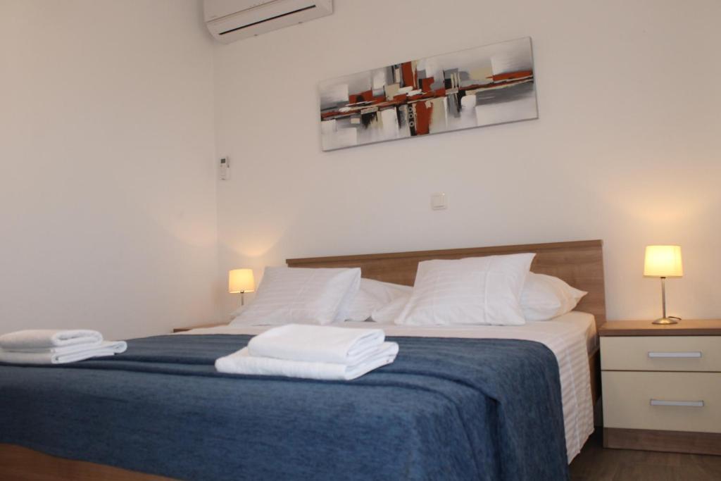 Posteľ alebo postele v izbe v ubytovaní Apartments Valeria