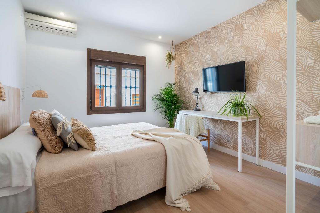 Televízia a/alebo spoločenská miestnosť v ubytovaní BF Rooms Carboneras
