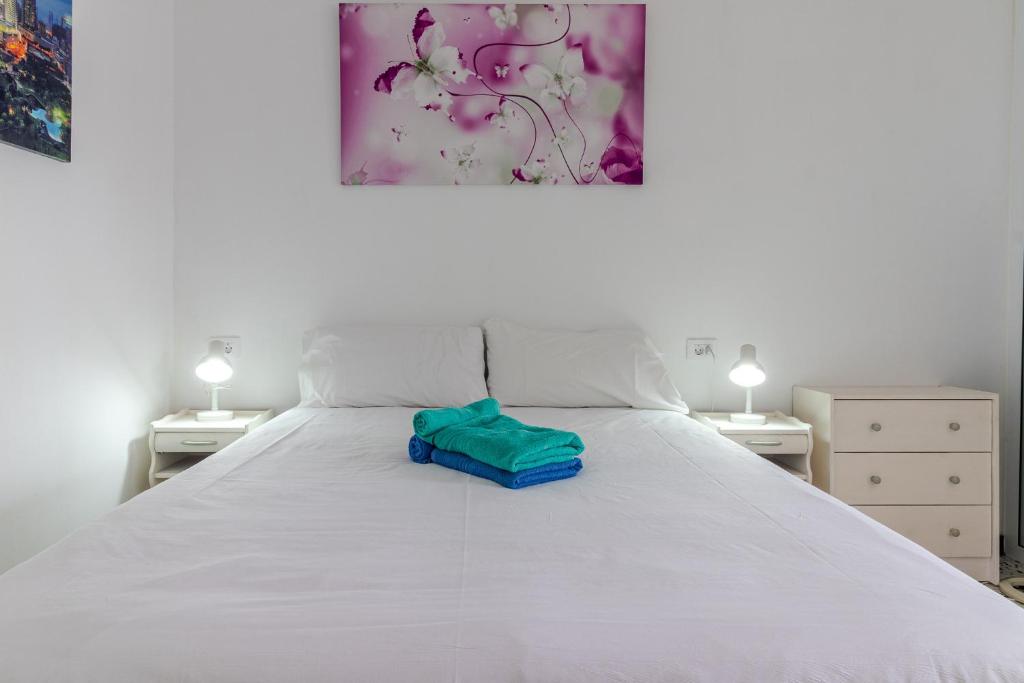 Posteľ alebo postele v izbe v ubytovaní Flatguest Central City