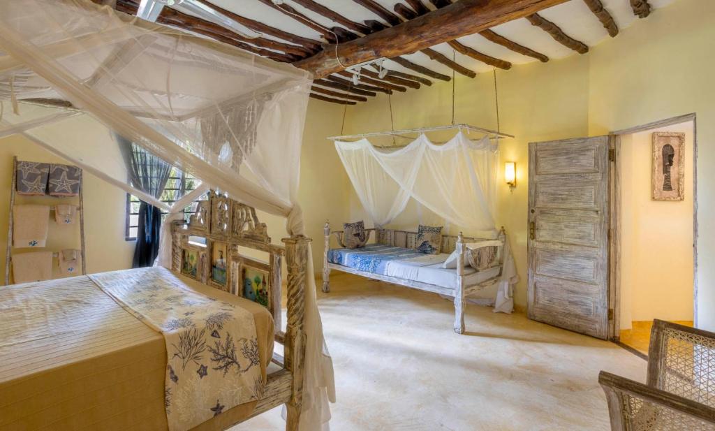Letto o letti in una camera di Aestus Villas Resort