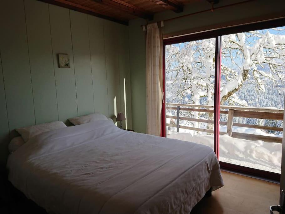Posteľ alebo postele v izbe v ubytovaní Maison d'altitude avec vue panoramique à Gérardmer